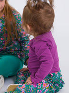 Baby Girls Plum Tart Knit Long Sleeve Ruffle Bodysuit - Premium Baby & Toddler Outfits from RuffleButts + RuggedButts - Just $24.95! Shop now at Pat's Monograms